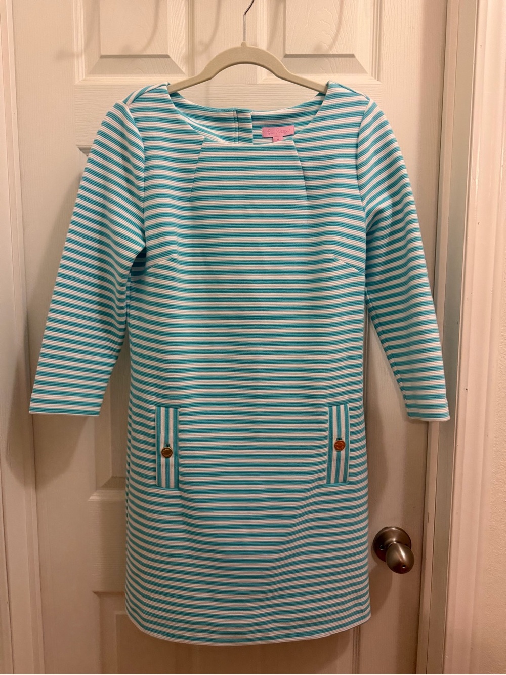 Woman's Lilly Pulitzer Charlene shift dress with blue and white stripes.